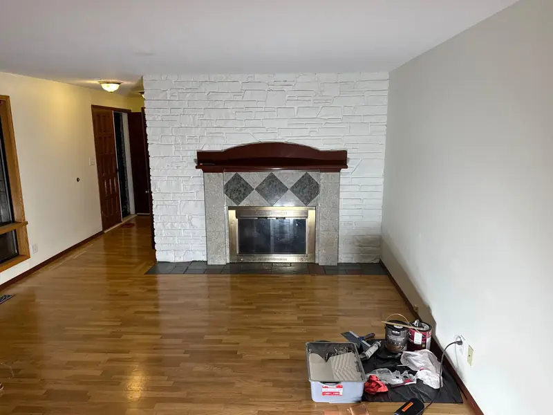 After: Stone fireplace painted white