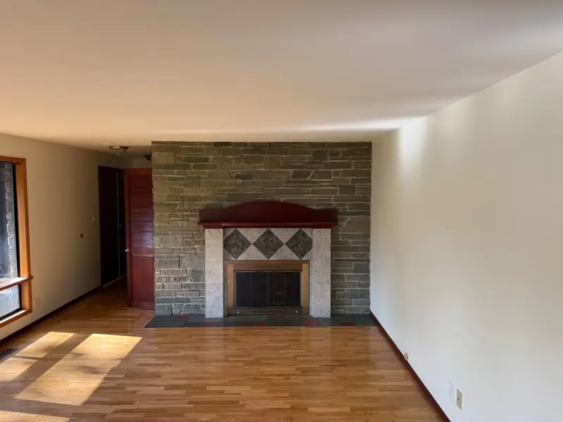 Before: Stone fireplace painted white